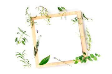 Food Design Template. A clipboard with herbs, shot from above on a white background with copyspace