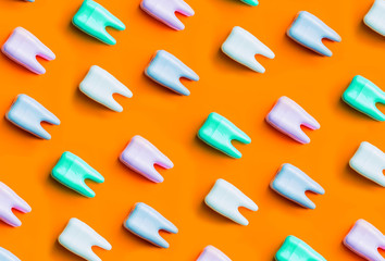 Teeth pattern on yellow bright background. Top view.