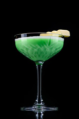 classic grasshopper cocktail with reflection on a dark background