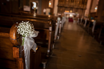 flowers decorating a church for a catholic ceremony