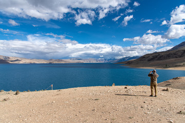 Landscape view of tourist man enjoy with beautiful of Tso-moriri lake in Leh Ladakh, India