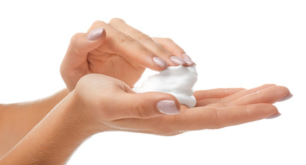 Female hands with soap foam on white background