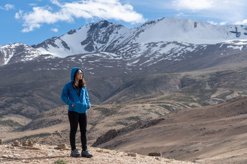 Landscape view of tourist woman enjoy with beautiful of Tso-moriri lake in Leh Ladakh, India