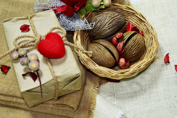 Gift boxes, Christmas tree golden ball,red heart put on sackcloth. Preparing to celebrate Christmas.