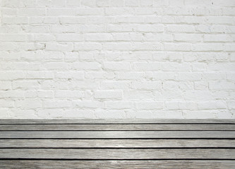 white brick wall and wood floor