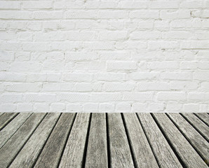 white brick wall and wood floor