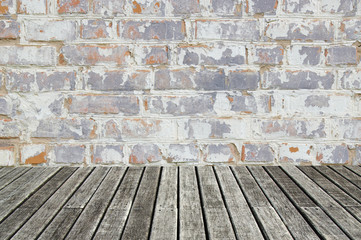 white brick wall and wood floor