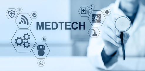 Medtech medical technology information integration internet big data concept on virtual screen. Doctor with stethoscope.