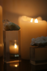 Burning candles on a nice table in the dark