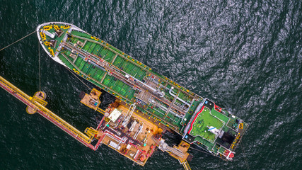 Tanker ship logistic and transportation business oil and gas industry in open sea, Aerial view.