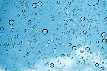 Rain on the window, natural skin of the rain The natural form of rainwater on a sky background.