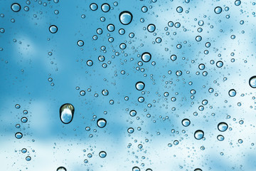 Rain on the window, natural skin of the rain The natural form of rainwater on a sky background.