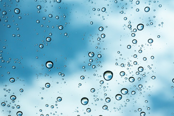 Rain on the window, natural skin of the rain The natural form of rainwater on a sky background.