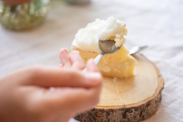 Asian beauty Scooping the cake to eat In Caffe Holiday idea Eating sweets, the cause of obesity, weight gain, poor health