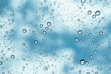 Rain on the window, natural skin of the rain The natural form of rainwater on a sky background.