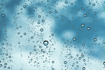 Rain on the window, natural skin of the rain The natural form of rainwater on a sky background.