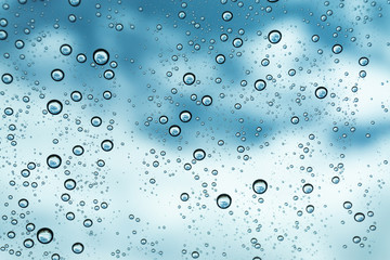 Rain on the window, natural skin of the rain The natural form of rainwater on a sky background.