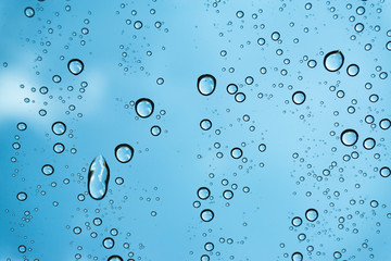 Rain on the window, natural skin of the rain The natural form of rainwater on a sky background.