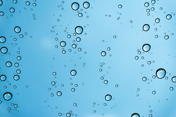 Rain on the window, natural skin of the rain The natural form of rainwater on a sky background.