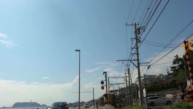 Railroad crossing where Enoshima can be seen