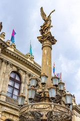 Fototapeta premium Statue of an angel in front of the Rudolfinum concert hall in Prague, Czech Republic.