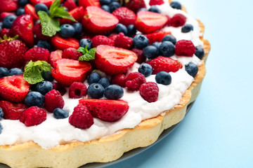 Tasty berry pie on color background, closeup