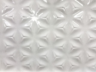 Ribbed ceramic tile white color. Glossy background