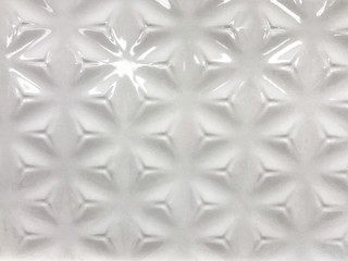 Fototapeta premium Ribbed ceramic tile white color. Glossy background