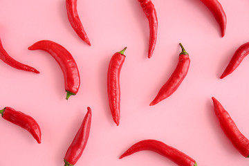 Red chili peppers on color background