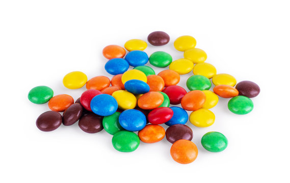 Round multi-colored sweets on a white background