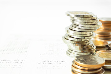 Coins stacked on each other in different positions. Saving money and account finance bank business concept. Business Finance and Money concept,Save money for prepare in the future.time is money concep