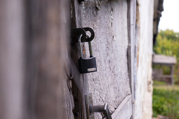 Door lock on an old wooden door.