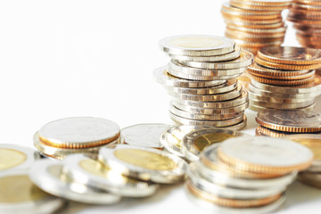 Coins stacked on each other in different positions. Saving money and account finance bank business concept. Business Finance and Money concept,Save money for prepare in the future.time is money concep