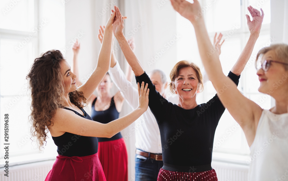 Wall mural group of senior people in dancing class with dance teacher. - Wall murals