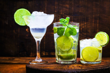 three cocktails of lemon alcohol. Brazilian caipirinha, cuban mojito and margarita frozem. World drinks, refreshing for the summer.