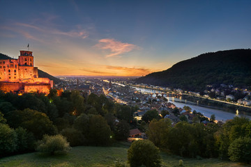 Fototapeta na wymiar Hstoric city of Heidelberg with the castle on the hill and bridge over the Neckar river during beautiful sunset