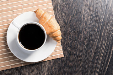 Cup of espresso coffee on wooden table