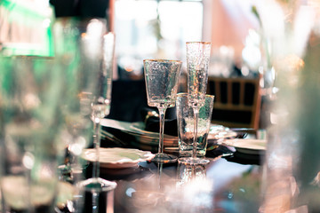 Luxury catering. Wedding or anniversary. Banquet. table served with cutlery, flowers, crockery.
