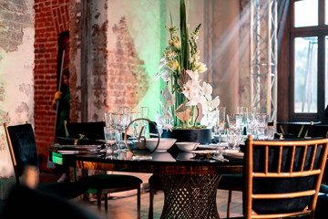 Luxury catering. Wedding or anniversary. Banquet. table served with cutlery, flowers, crockery.