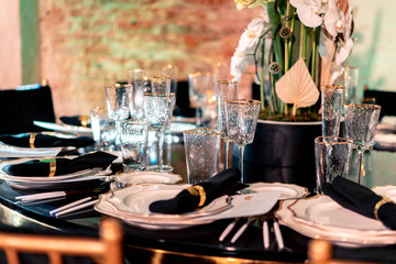 Luxury catering. Wedding or anniversary. Banquet. table served with cutlery, flowers, crockery.