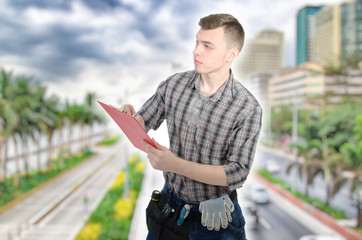 Engineer. Young attractive guy and tools.