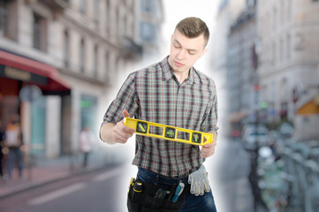 Engineer. Young attractive guy and tools.