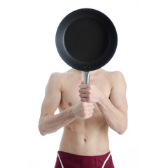 Young attractive guy in the kitchen.