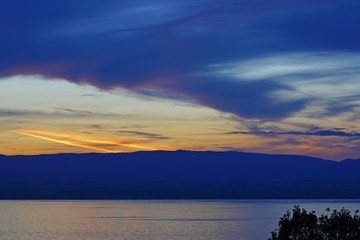 Fototapeta na wymiar Colorful sunset sky over Lake Geneva in Evian-les-Bains, Haute-Savoie, France