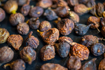 Organic dried figs close up, vegetarian food background