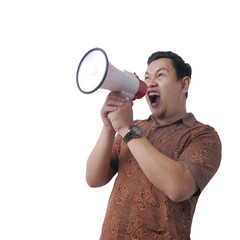 Asian Man Wearing Batik Shouting With Megaphone