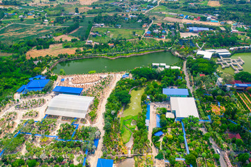 Fototapeta premium Aerial view of tropical garden in Chonburi province, Thailand. Aerial view from drone