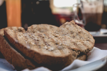 toasted bread placed on a plate at the terrace