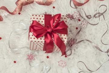 Obraz na płótnie Canvas Festive background with a Christmas gift and Christmas decor items .