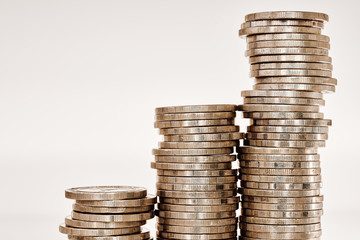 Coins stack Close up. Concept of investment growth, business success and savings on white background with copy space